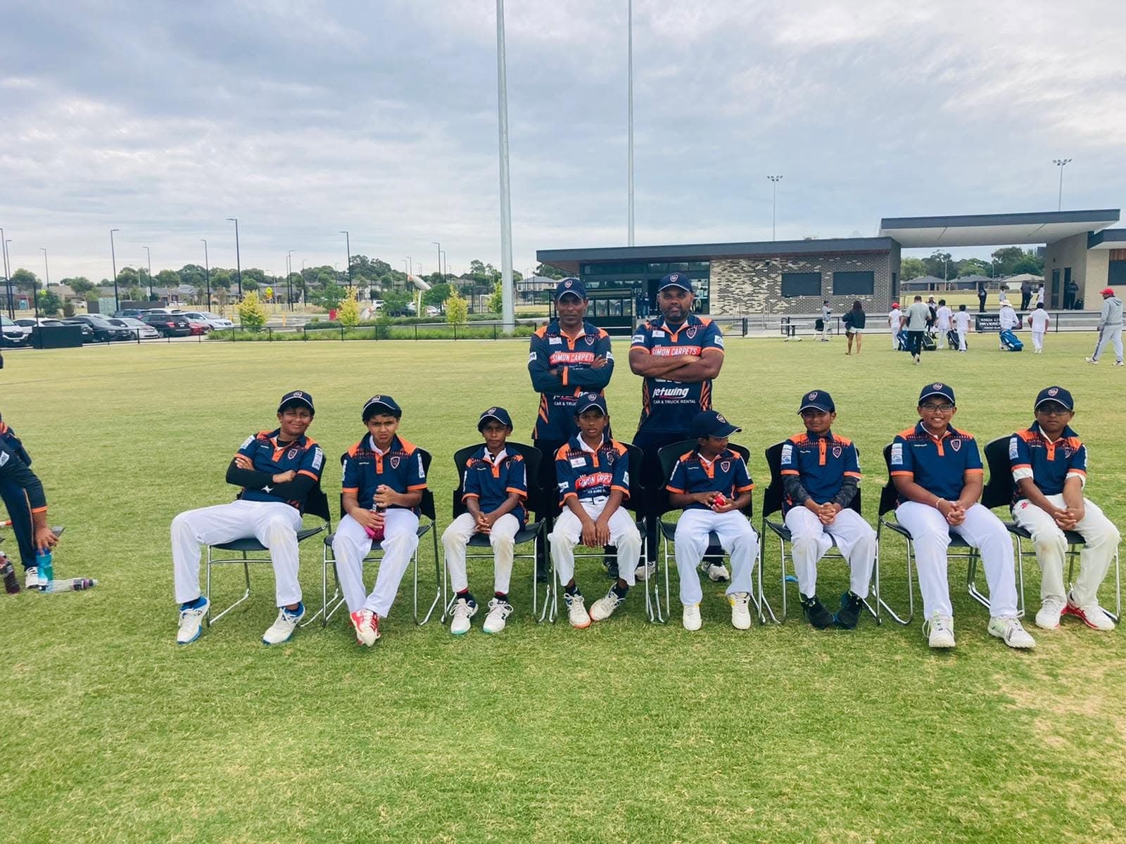 Melbourne Titans junior squad and coaches on match day